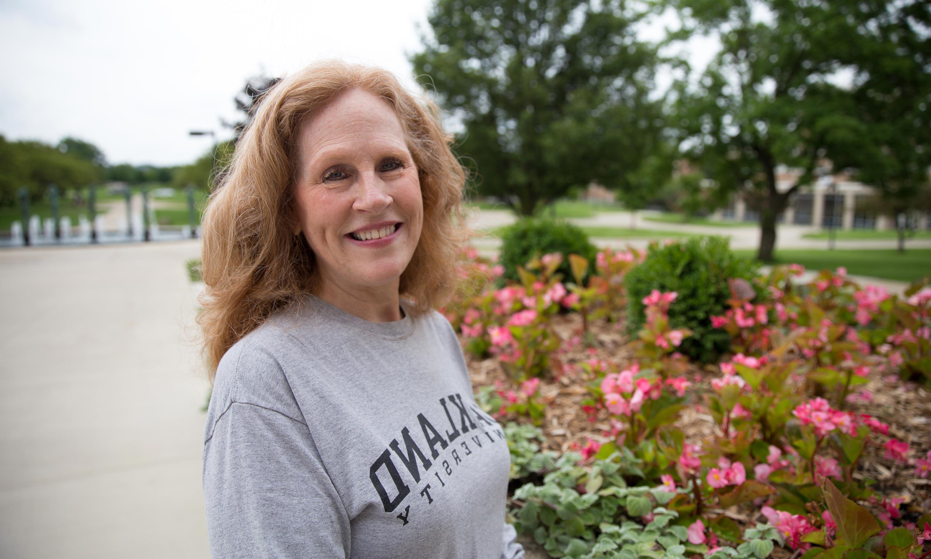 Educator Zita Burton in front of Kresge library at Oakland University